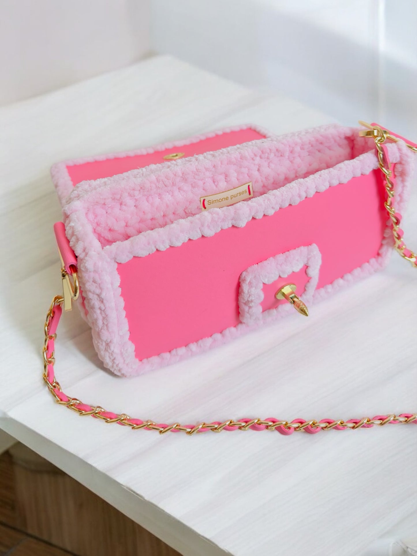 Trendy pink handbag with stripes