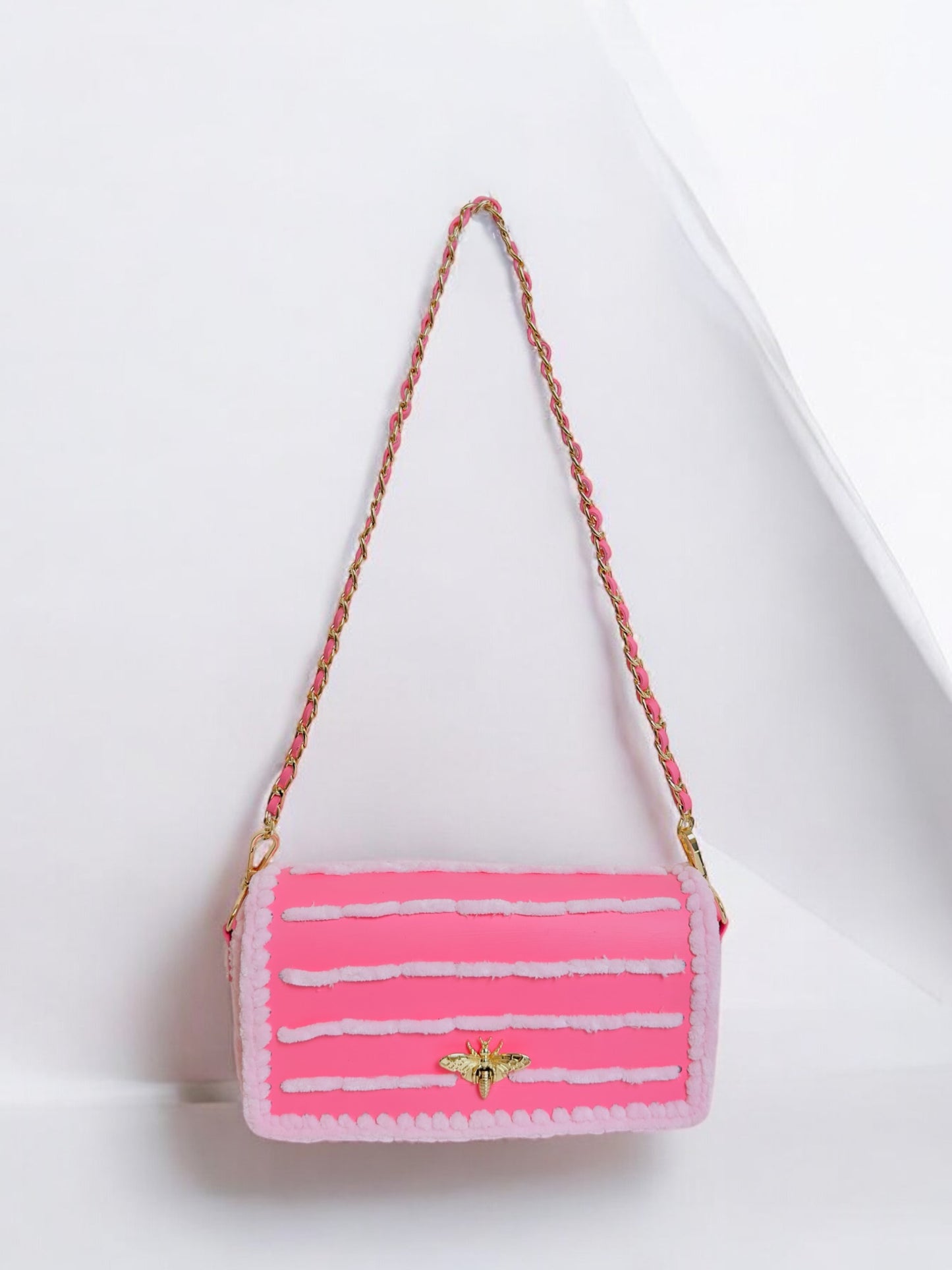 Trendy pink handbag with stripes