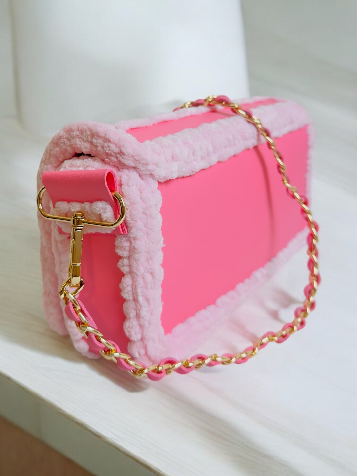 Trendy pink handbag with stripes